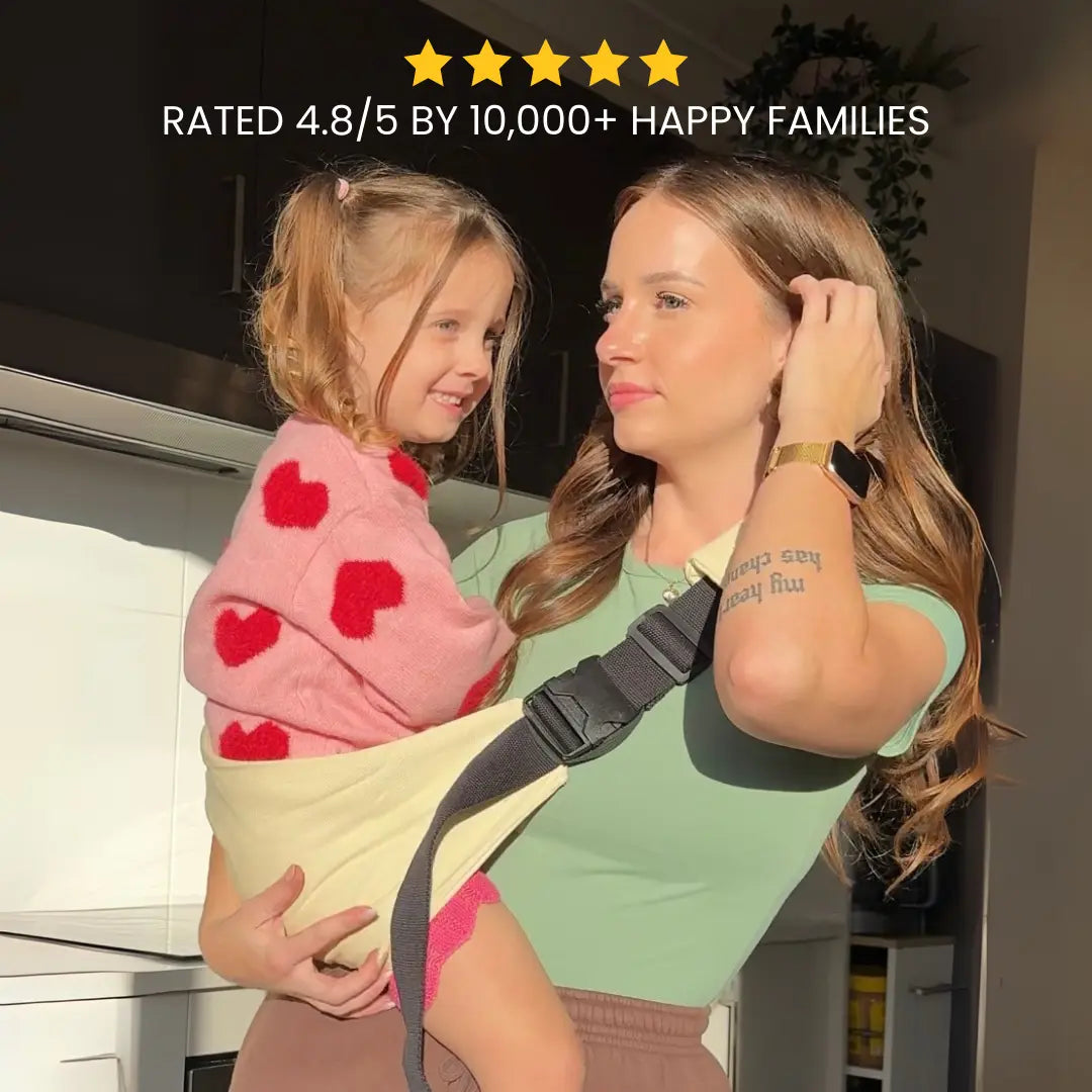 Woman holding a child in a sling