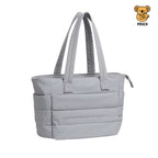 Light blue tote bag with straps on a beige background