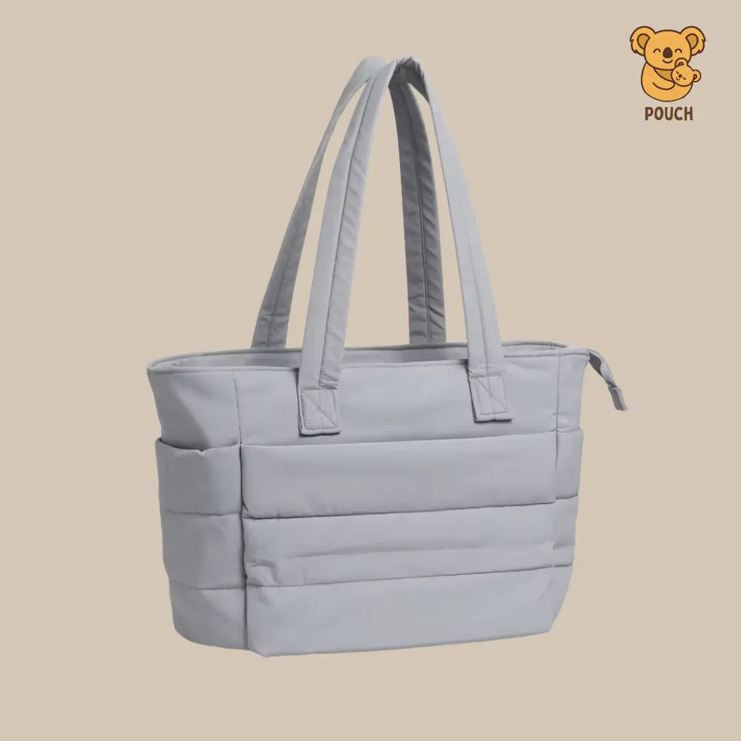 Light blue tote bag with straps on a beige background