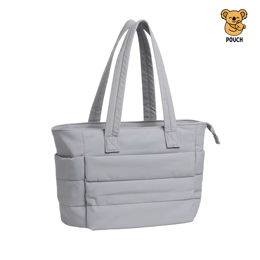 Light blue tote bag with straps on a beige background