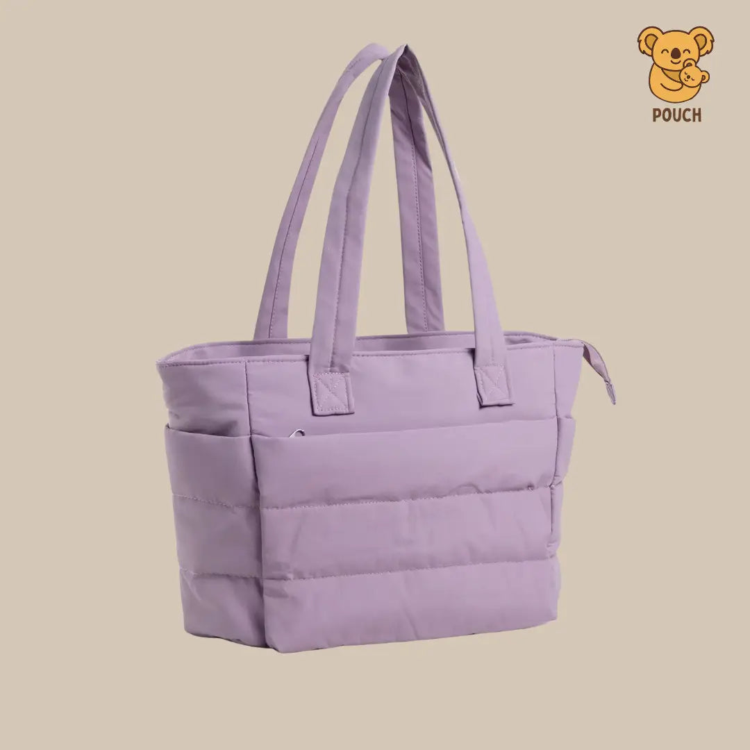Purple tote bag on a beige background with a brand logo in the corner.
