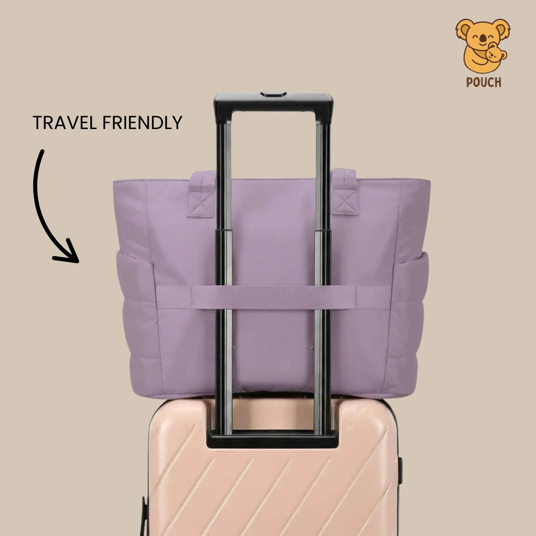 Purple travel pouch on a suitcase with 'Travel Friendly' text and a brand logo.