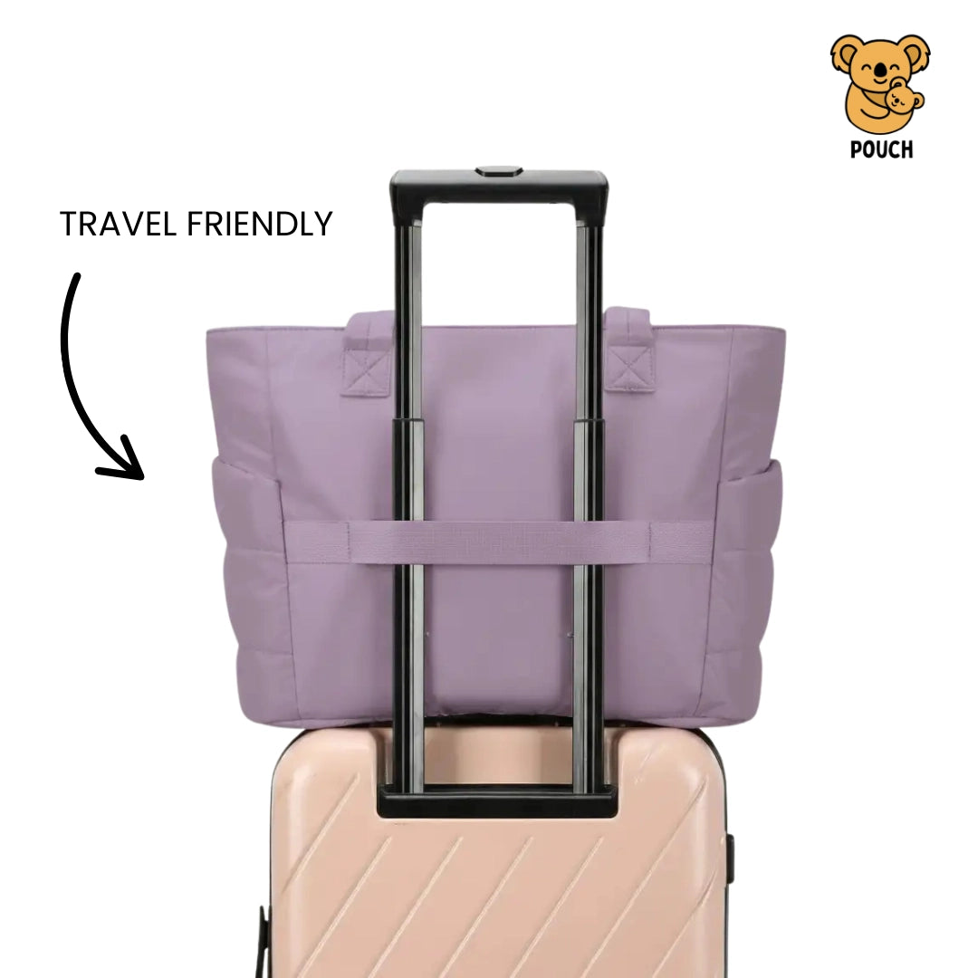 Purple travel pouch on a suitcase with 'Travel Friendly' text and a brand logo.