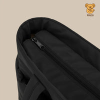 Black pouch with zipper on a beige background