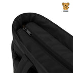 Black pouch with zipper on a beige background