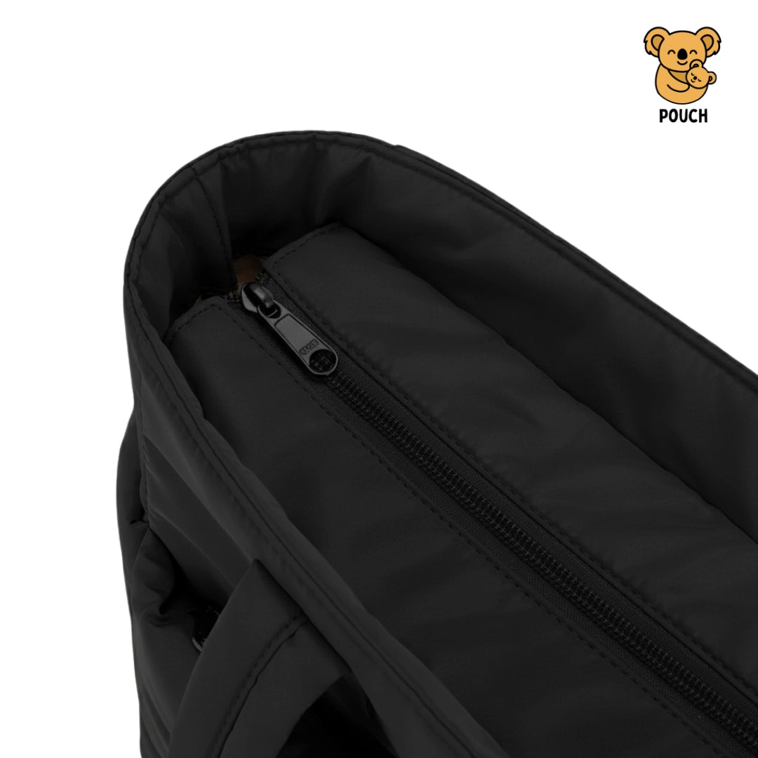 Black pouch with zipper on a beige background